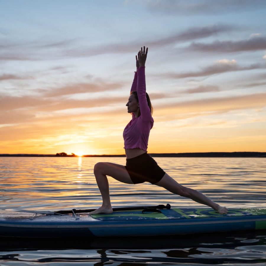 full-shot-woman-doing-yoga-paddleboard (1)